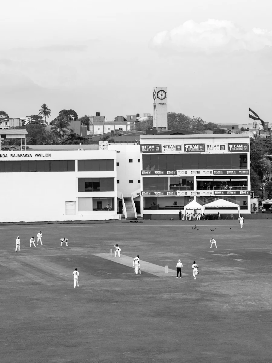 A cricket match in progress at a stadium
